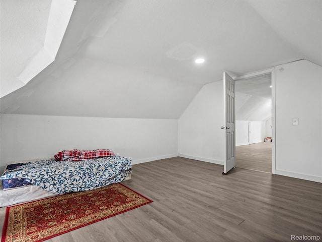 11727 Fleming St, Hamtramck, MI 48212 - bedroom featuring lofted ceiling and wood finished floors