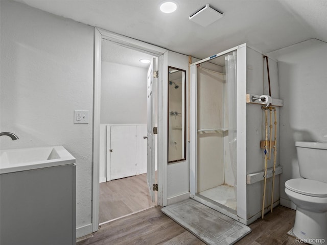 11727 Fleming St, Hamtramck, MI 48212 - full bath featuring wood finished floors, a shower stall, vanity, and vaulted ceiling