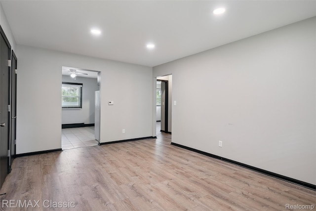 3241MARSHALLAVENUE 3241 Marshall Ave SE, Kentwood, MI 49508 - empty room featuring light wood finished floors, recessed lighting, and a ceiling fan