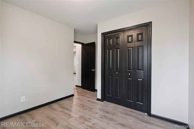 3241MARSHALLAVENUE 3241 Marshall Ave SE, Kentwood, MI 49508 - unfurnished bedroom with light wood-style floors and a closet