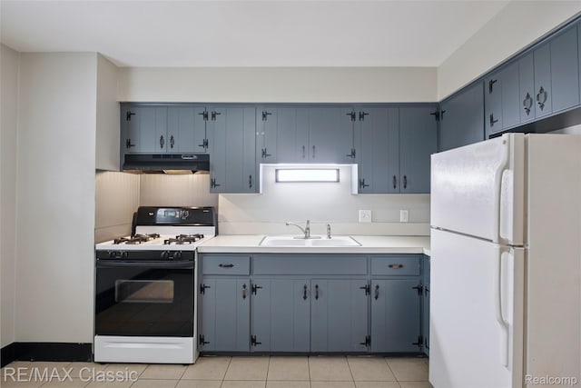 3241MARSHALLAVENUE 3241 Marshall Ave SE, Kentwood, MI 49508 - kitchen with freestanding refrigerator, range with gas cooktop, blue cabinets, under cabinet range hood, and light countertops