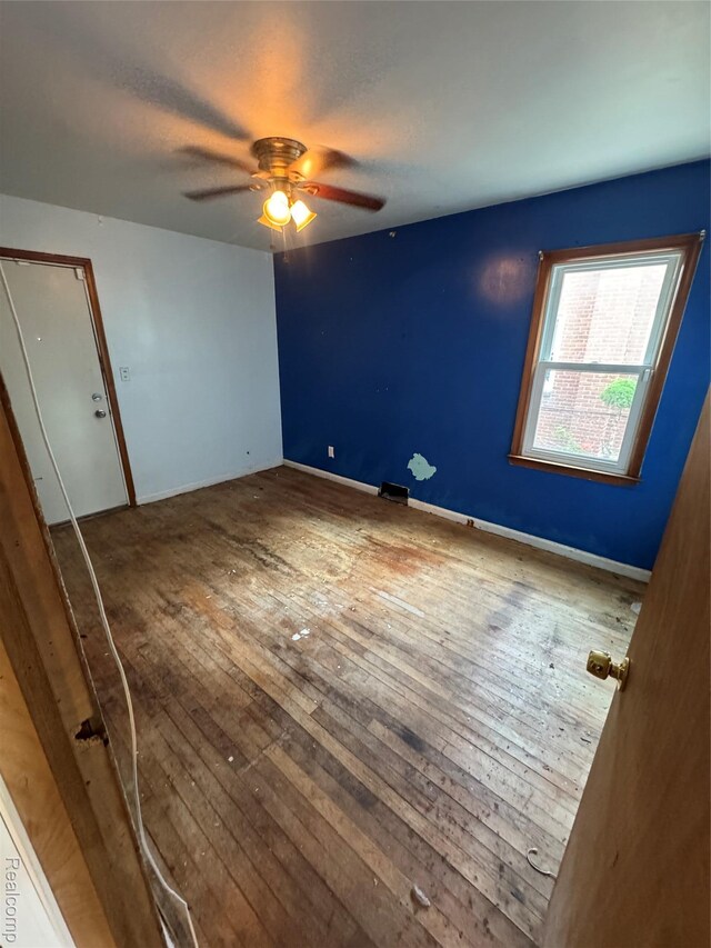 19421 Huntington Rd, Detroit, MI 48219 - unfurnished room featuring wood-type flooring and a ceiling fan