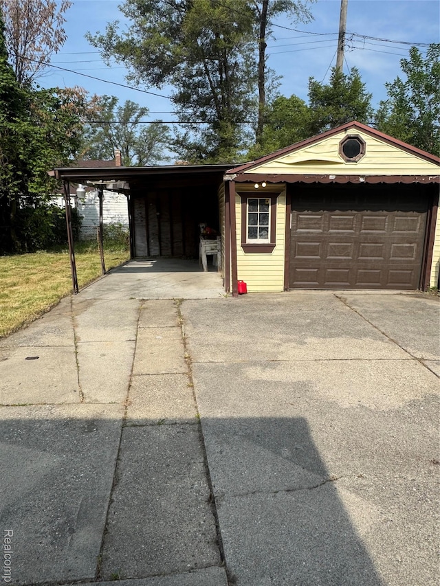 19421 Huntington Rd, Detroit, MI 48219 - garage featuring concrete driveway and a detached garage