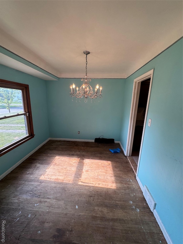 19421 Huntington Rd, Detroit, MI 48219 - unfurnished dining area with a chandelier and wood finished floors