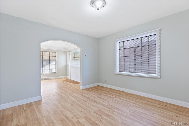 14903 Tracey St, Detroit, MI 48227 - unfurnished room with arched walkways and wood finished floors