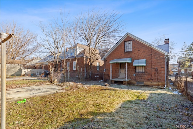 14903 Tracey St, Detroit, MI 48227 - rear view of house with brick siding and a chimney