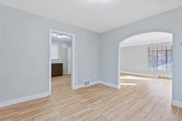 14903 Tracey St, Detroit, MI 48227 - unfurnished room featuring arched walkways and light wood-style floors