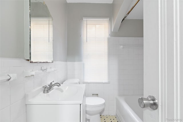 14903 Tracey St, Detroit, MI 48227 - bathroom featuring tile walls, vanity, a tub, a wainscoted wall, and tile patterned flooring