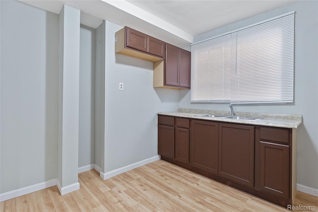 14903 Tracey St, Detroit, MI 48227 - kitchen with light wood-type flooring and light stone counters