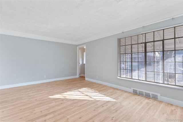 14903 Tracey St, Detroit, MI 48227 - empty room with light wood-style floors and ornamental molding