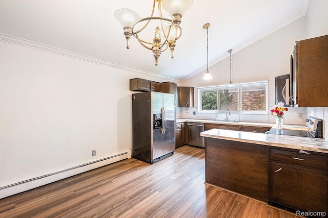 720 E Grand Blanc Rd, Grand Blanc, MI 48439 - kitchen featuring appliances with stainless steel finishes, a baseboard radiator, vaulted ceiling, dark brown cabinetry, and a chandelier