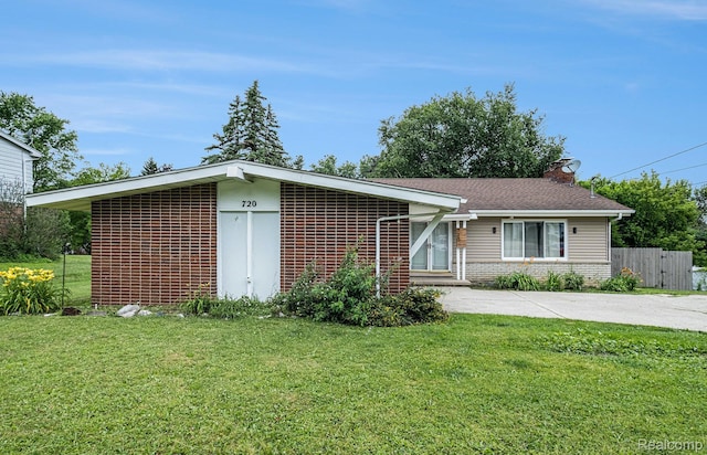 720 E Grand Blanc Rd, Grand Blanc, MI 48439 - ranch-style house featuring brick siding, a chimney, and driveway