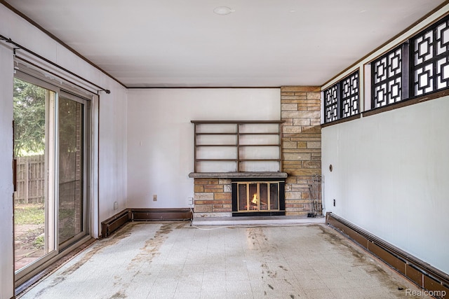 720 E Grand Blanc Rd, Grand Blanc, MI 48439 - unfurnished living room featuring a baseboard heating unit and a stone fireplace