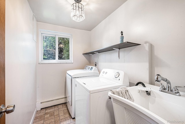 720 E Grand Blanc Rd, Grand Blanc, MI 48439 - laundry room featuring baseboard heating, washer and clothes dryer, and a chandelier