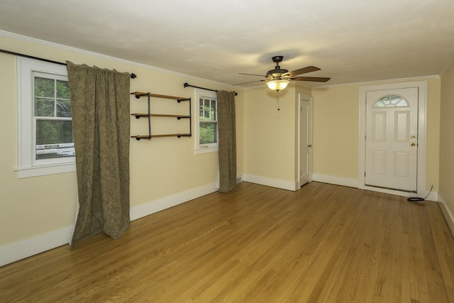907 Pearl St, Ypsilanti, MI 48197 - unfurnished room featuring light wood-style floors, ceiling fan, and crown molding
