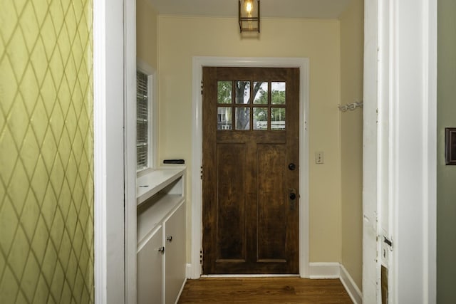 907 Pearl St, Ypsilanti, MI 48197 - doorway to outside featuring dark wood-type flooring and baseboards