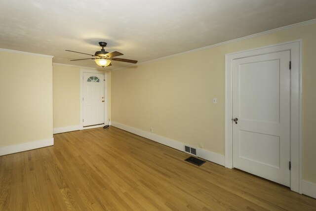 907 Pearl St, Ypsilanti, MI 48197 - unfurnished room with ceiling fan, light wood finished floors, and crown molding