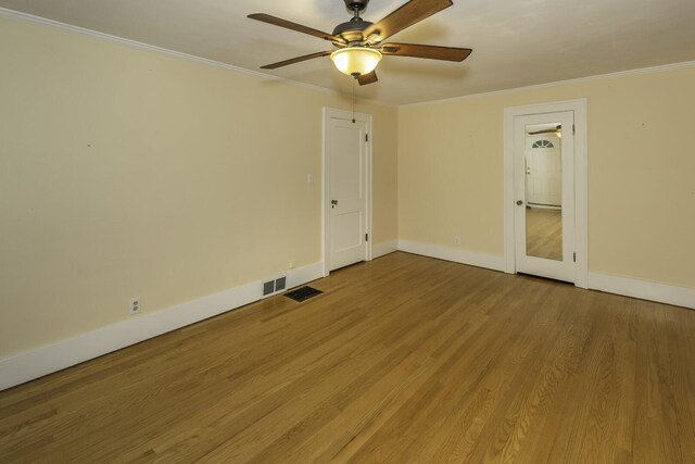 907 Pearl St, Ypsilanti, MI 48197 - unfurnished room featuring ornamental molding, ceiling fan, and wood finished floors