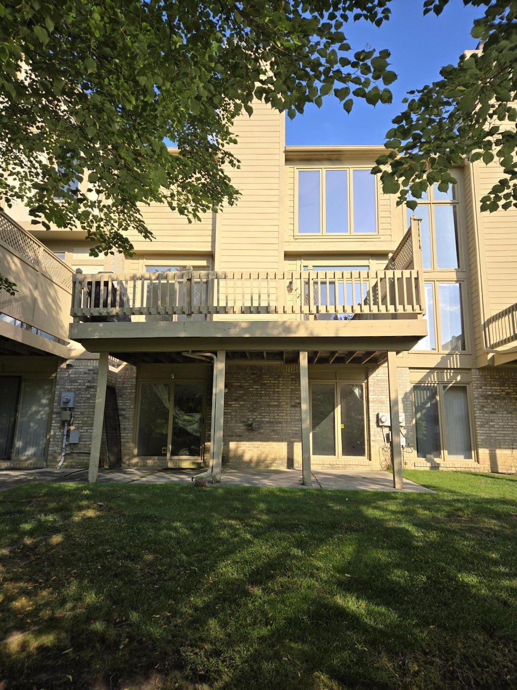 2782 Maitland Dr, Ann Arbor, MI 48105 - rear view of house with a yard, a wooden deck, and a patio