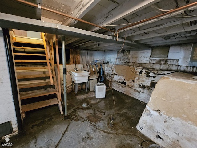 209 W Stewart St, Owosso, MI 48867 - unfinished below grade area with a sink