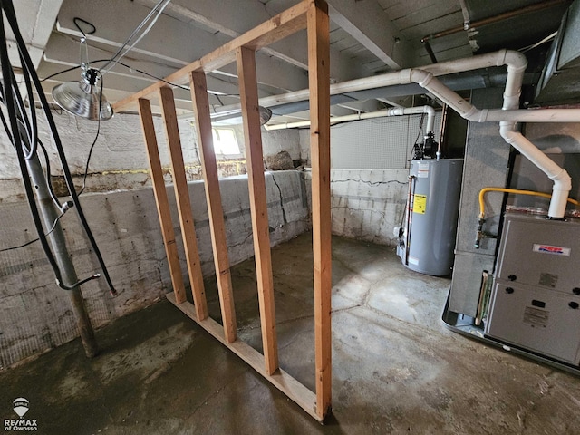 209 W Stewart St, Owosso, MI 48867 - unfinished below grade area featuring water heater and heating unit