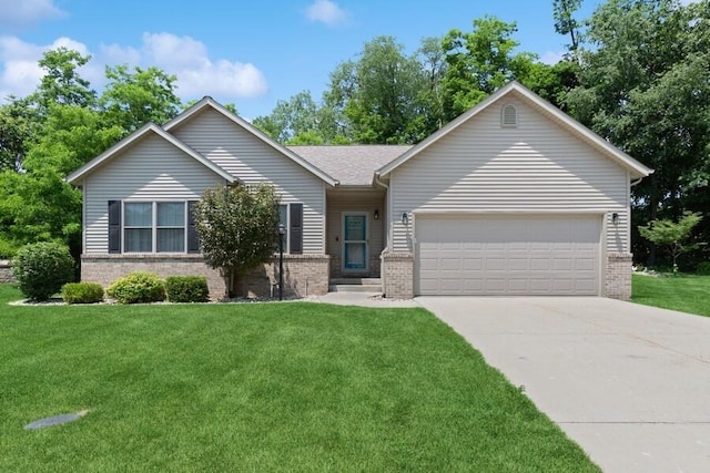450 Carefree Ct, Niles, MI 49120 - ranch-style house featuring brick siding, a garage, concrete driveway, and a front lawn