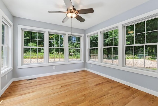 450 Carefree Ct, Niles, MI 49120 - unfurnished sunroom with baseboards and wood finished floors