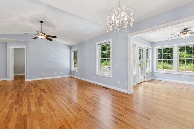 450 Carefree Ct, Niles, MI 49120 - unfurnished room with ceiling fan, light wood-style flooring, lofted ceiling, and a chandelier