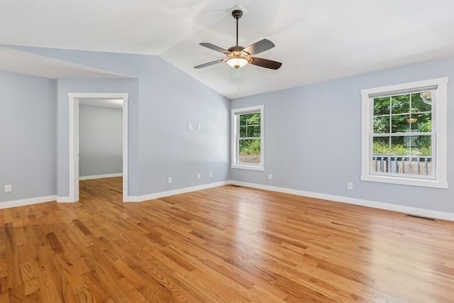 450 Carefree Ct, Niles, MI 49120 - empty room featuring plenty of natural light, light wood-style flooring, ceiling fan, and vaulted ceiling