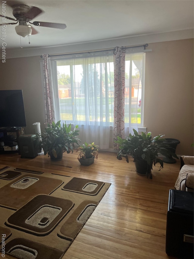 20120 N Covington Pkwy, Southfield, MI 48221 - living area with a ceiling fan, wood finished floors, and ornamental molding
