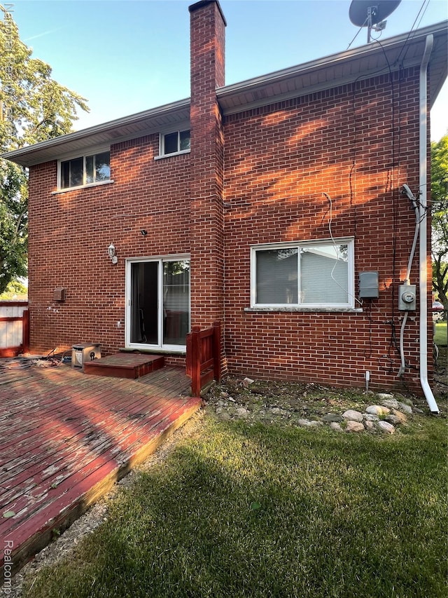 20120 N Covington Pkwy, Southfield, MI 48221 - rear view of property with a chimney, a wooden deck, and brick siding