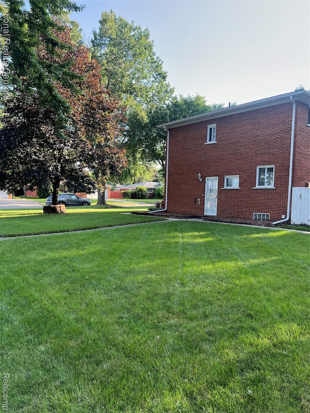 20120 N Covington Pkwy, Southfield, MI 48221 - view of property exterior with a yard and brick siding