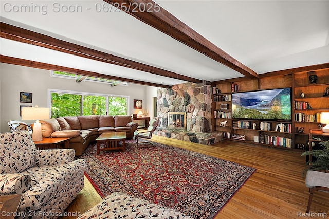 7340 Deer Lake Rd, Clarkston, MI 48346 - living area with beamed ceiling, hardwood / wood-style floors, and a stone fireplace