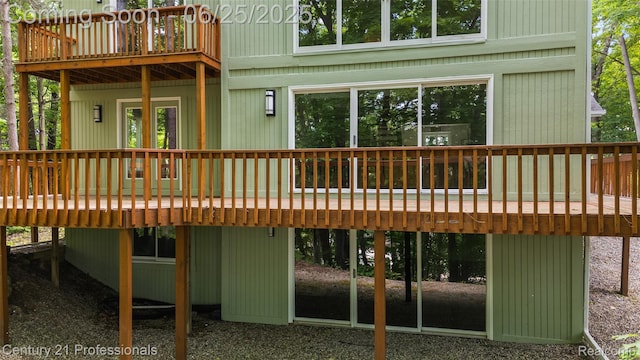 7340 Deer Lake Rd, Clarkston, MI 48346 - rear view of house featuring a deck