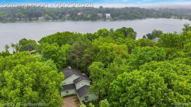 7340 Deer Lake Rd, Clarkston, MI 48346 - drone / aerial view of a nearby body of water and a forest