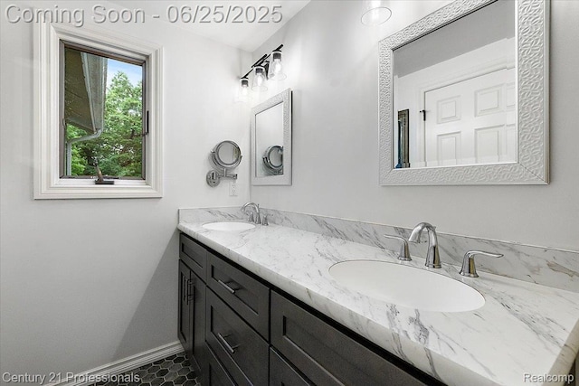 7340 Deer Lake Rd, Clarkston, MI 48346 - bathroom with double vanity and baseboards