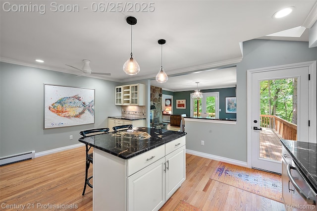 7340 Deer Lake Rd, Clarkston, MI 48346 - kitchen featuring crown molding, light wood finished floors, baseboard heating, glass insert cabinets, and a breakfast bar