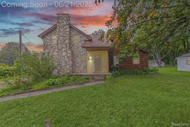 47645 Sugarbush Rd, Chesterfield, MI 48047 - view of front of house with a front lawn and a chimney