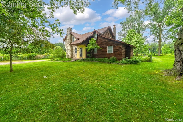 47645 Sugarbush Rd, Chesterfield, MI 48047 - view of property exterior featuring a chimney and a yard