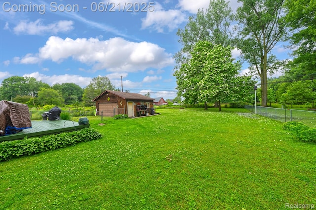 47645 Sugarbush Rd, Chesterfield, MI 48047 - view of yard featuring a detached garage, a deck, and an outbuilding