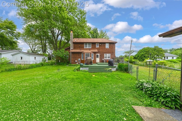 47645 Sugarbush Rd, Chesterfield, MI 48047 - back of property with a deck, a fenced backyard, and a chimney