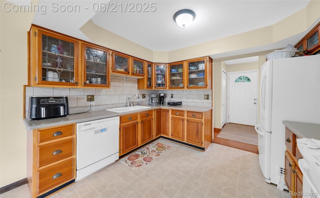 47645 Sugarbush Rd, Chesterfield, MI 48047 - kitchen featuring white appliances, light countertops, backsplash, brown cabinets, and light floors