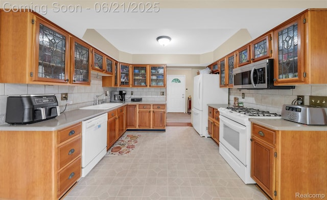 47645 Sugarbush Rd, Chesterfield, MI 48047 - kitchen featuring white appliances, tasteful backsplash, light countertops, and glass insert cabinets