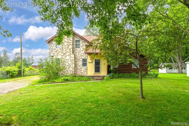 47645 Sugarbush Rd, Chesterfield, MI 48047 - view of front of home featuring stone siding, a front lawn, and roof with shingles