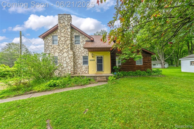 47645 Sugarbush Rd, Chesterfield, MI 48047 - view of front of home featuring a front lawn, a shingled roof, a chimney, and stone siding