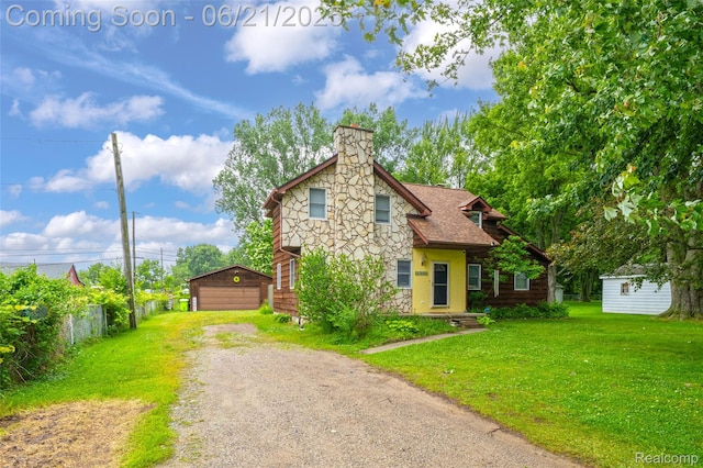 47645 Sugarbush Rd, Chesterfield, MI 48047 - view of front of property featuring stone siding, an outdoor structure, a garage, a front lawn, and a chimney