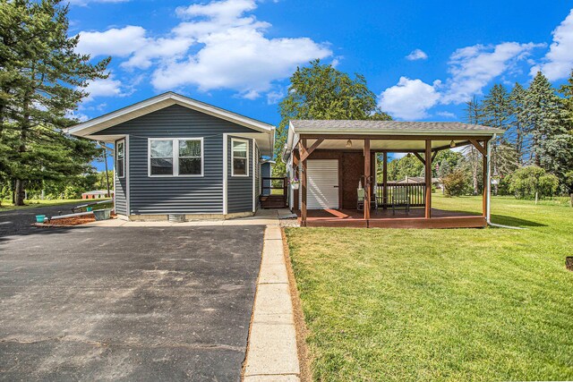 8150 B Dr N, Battle Creek, MI 49014 - view of front facade with a gazebo, a front yard, and a deck