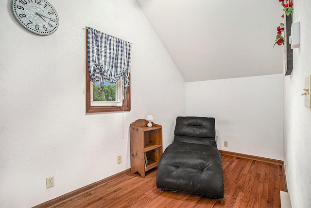 8150 B Dr N, Battle Creek, MI 49014 - living area featuring vaulted ceiling and wood finished floors