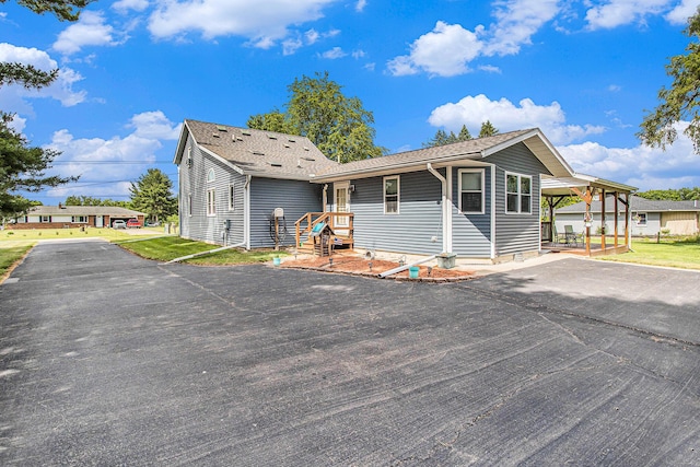 8150 B Dr N, Battle Creek, MI 49014 - view of front of property featuring driveway and roof with shingles