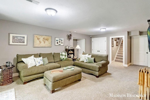 1728 N Brandon Ridge Dr NW, Walker, MI 49544 - carpeted living room featuring stairway and baseboards